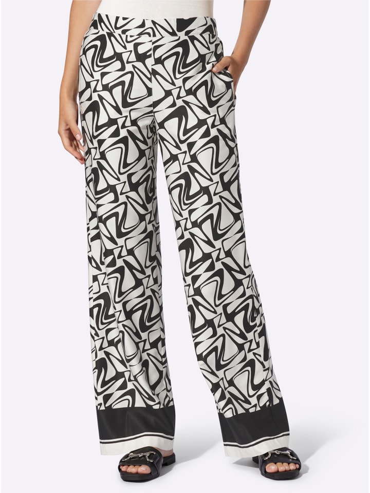 

Брюки-карго черного цвета с принтом шампанского Heine