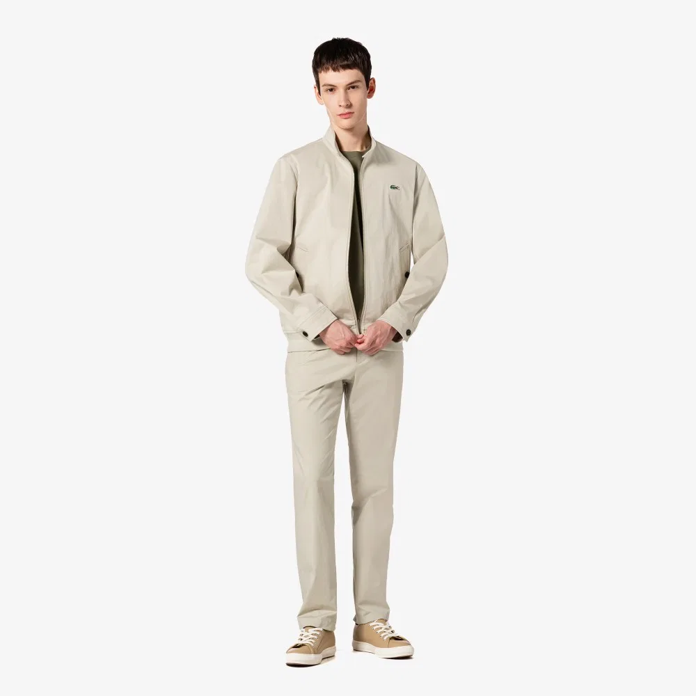 Мужские чиносы из смесовой ткани бежевые от Lacoste