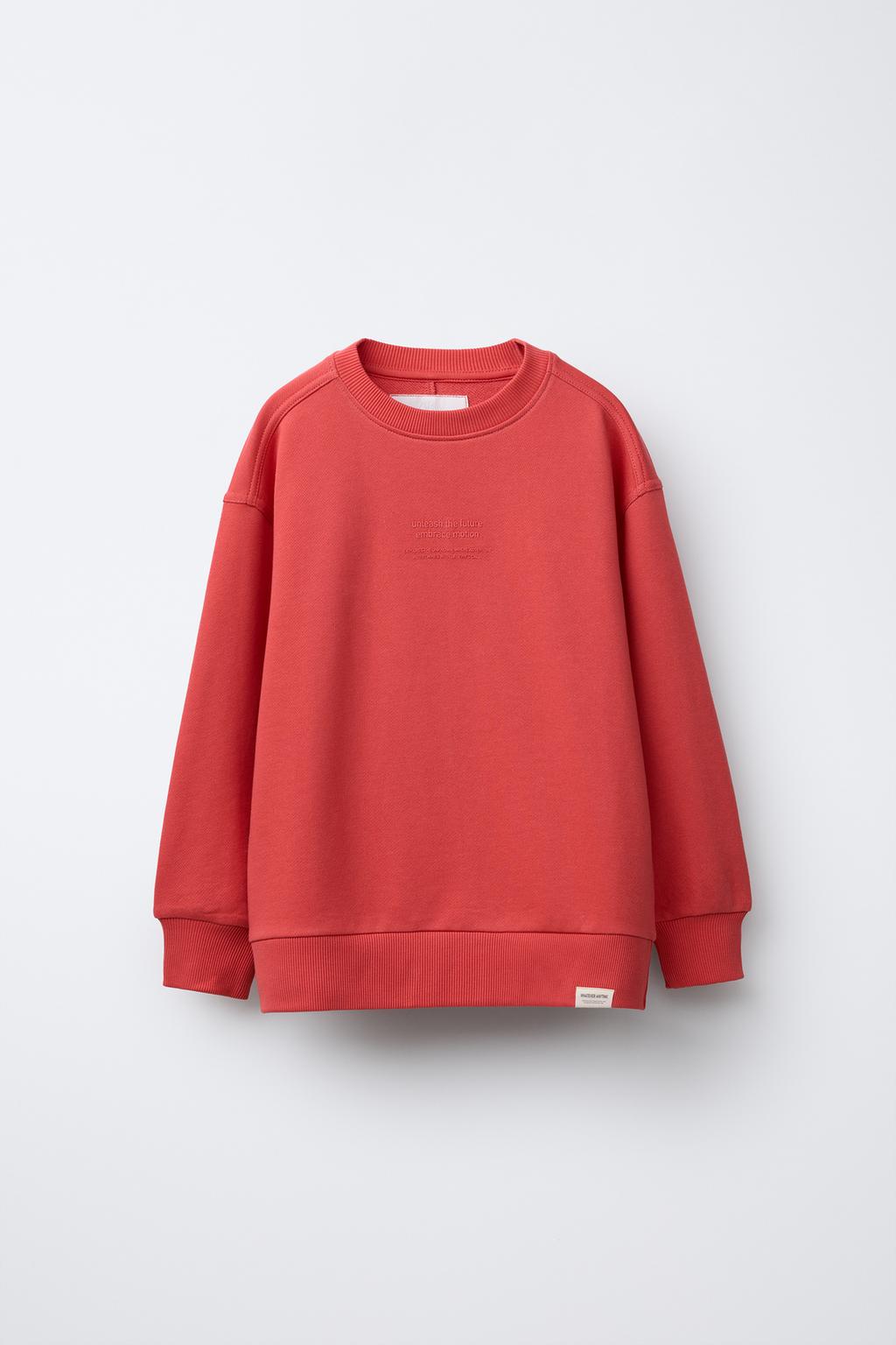 

Однотонная толстовка с рельефным слоганом ZARA, цвет Coral