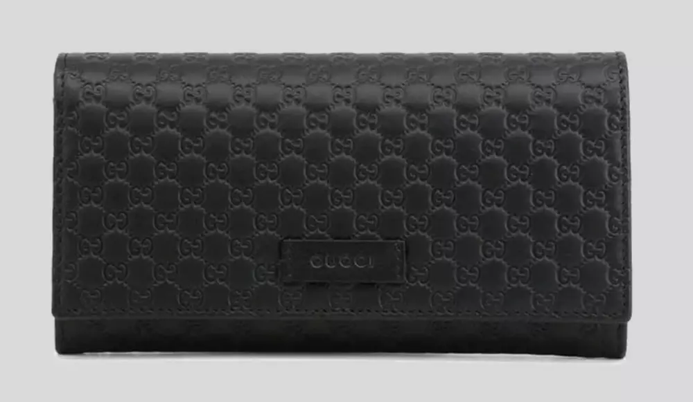 

Элегантный кожаный кошелек Microguccissima черного цвета Gucci