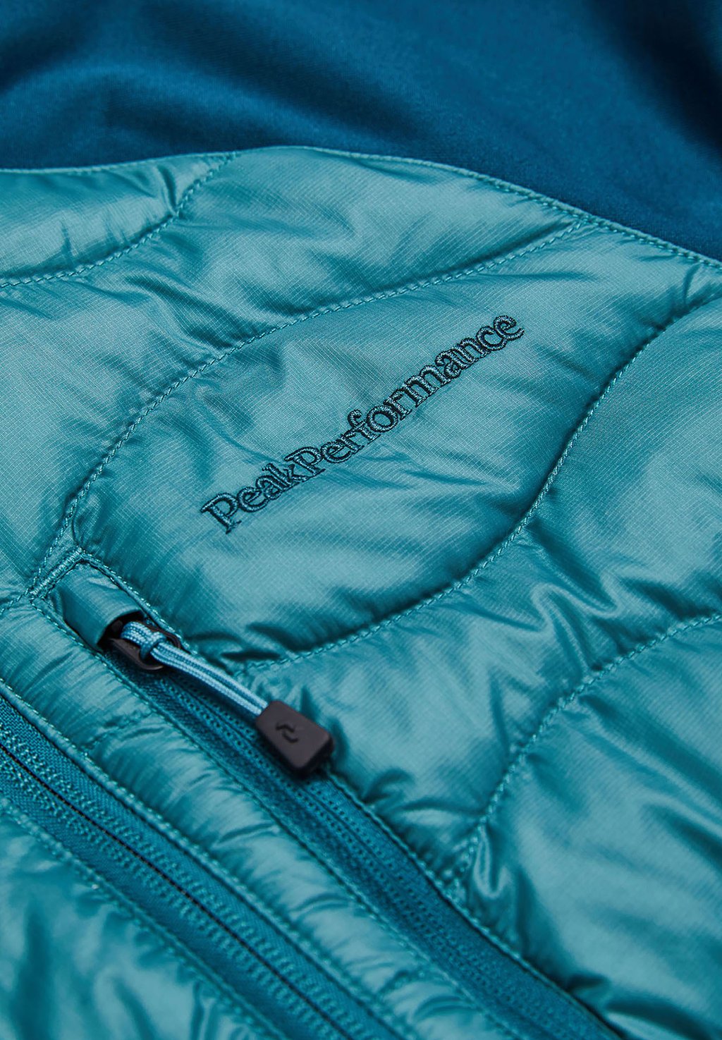 

Пуховик W HELIUM HYBRID HOOD Peak Performance, бирюзовый