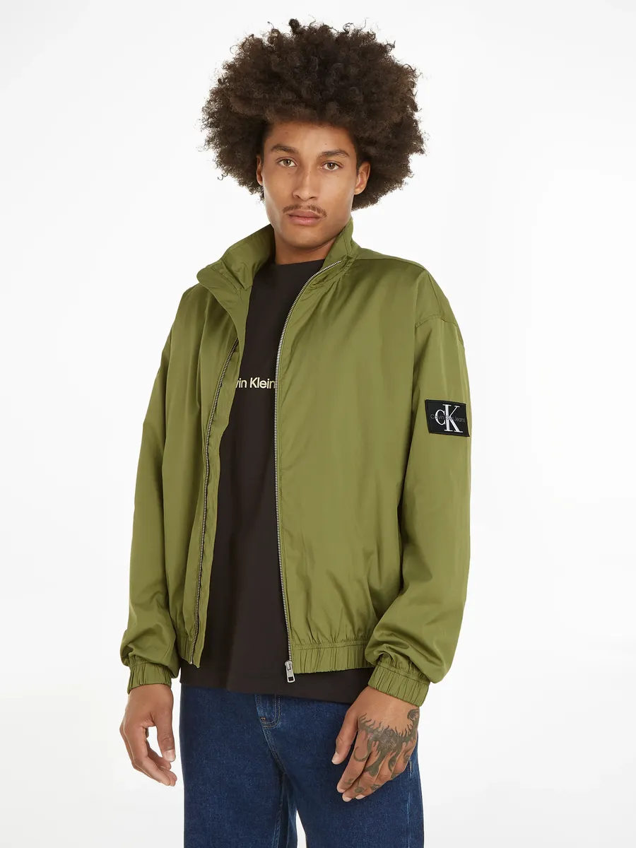 

Куртка Calvin Klein Jeans "CASUAL UTILITY HARRINGTON" с нашивкой-логотипом, цвет Dark Juniper