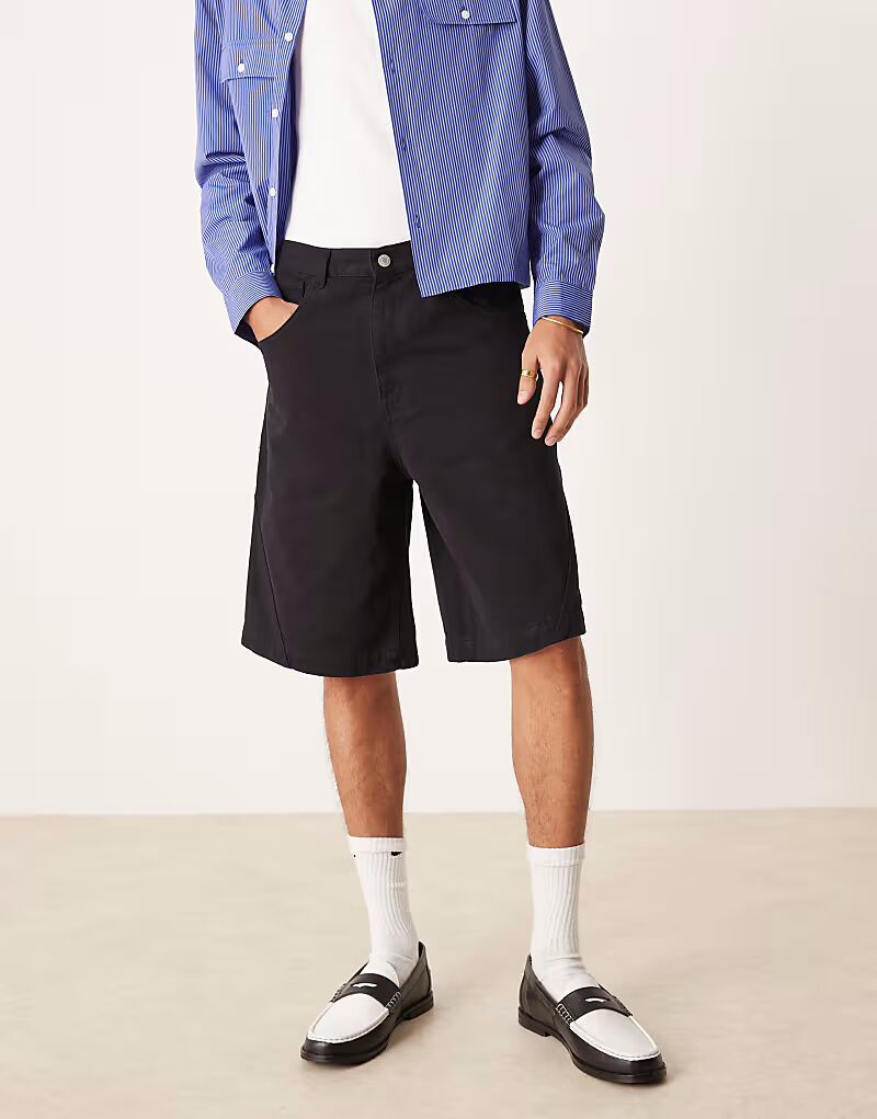 

Длинные джинсовые шорты ASOS DESIGN черного цвета с перекрученным швом