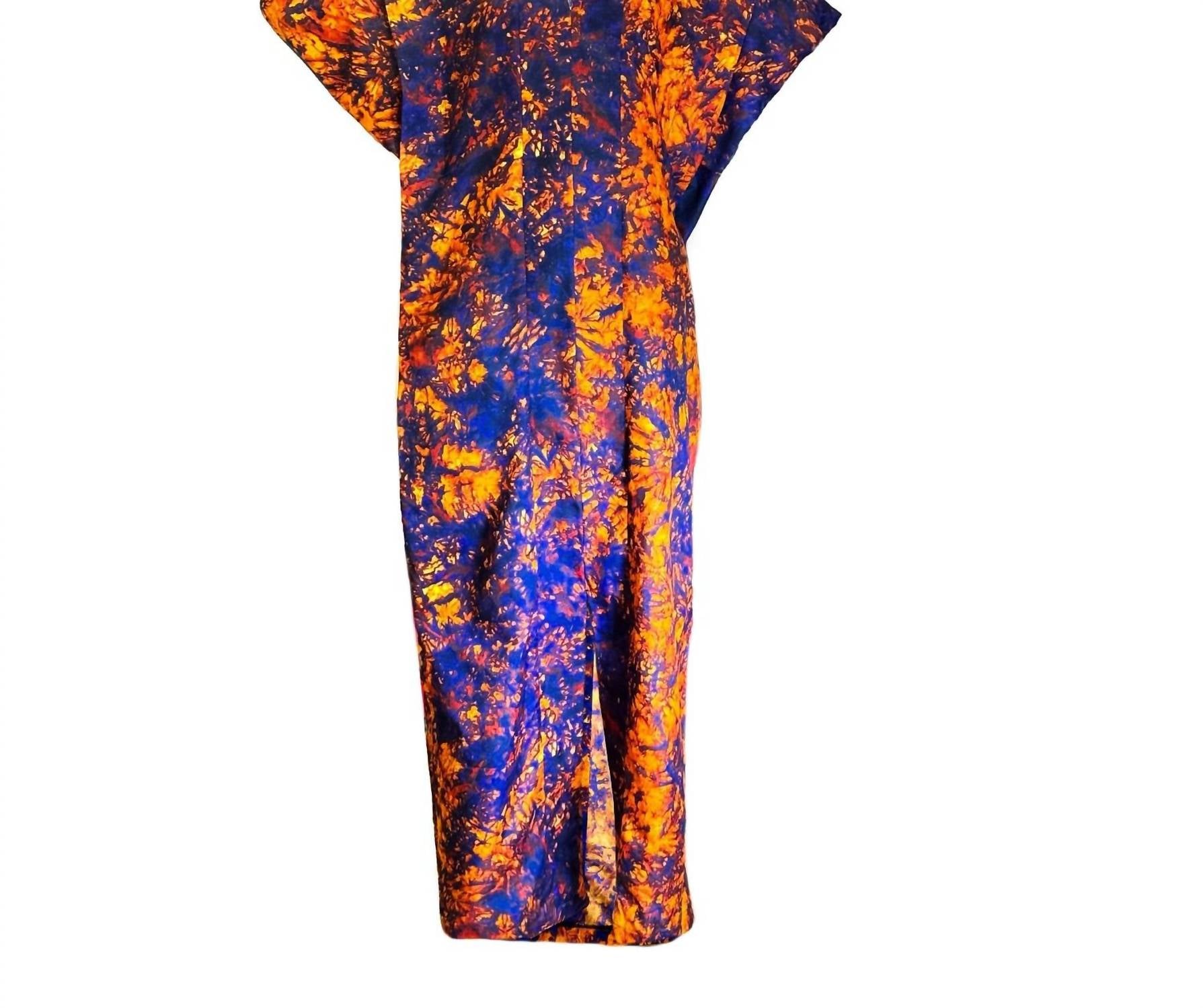 

Женское длинное платье с разрезом в желто-оранжевом цвете Chuks Collins