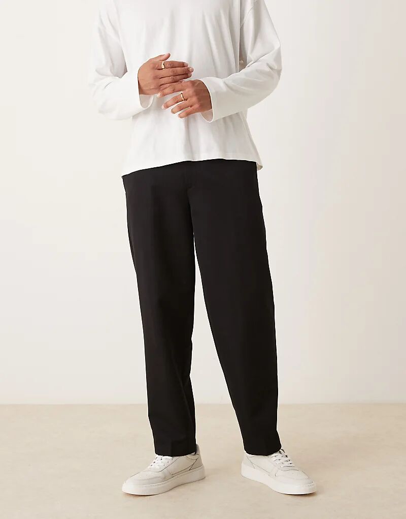 

Элегантные зауженные брюки свободного кроя со складкой спереди черного цвета от ASOS DESIGN