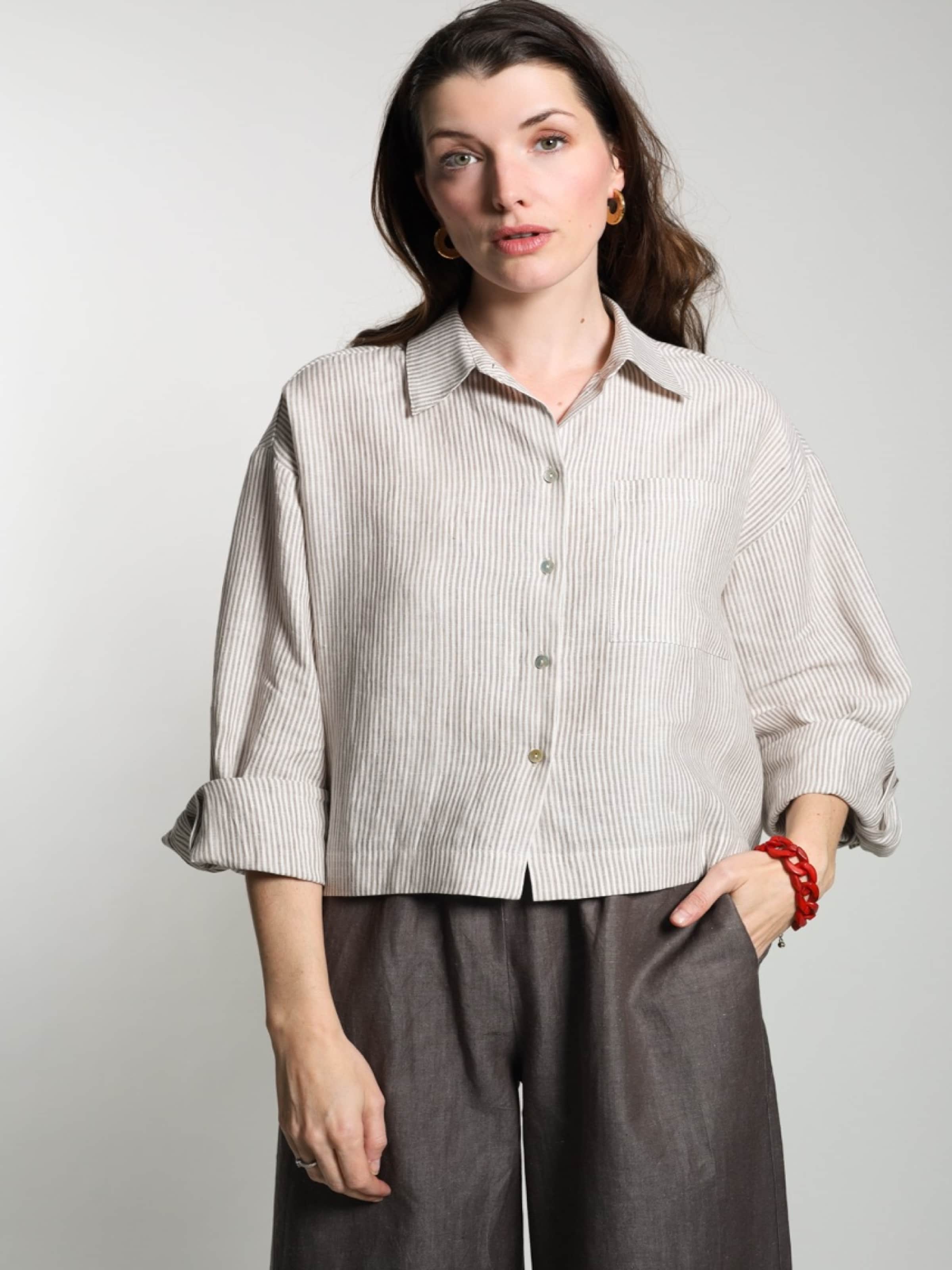 

WEARABLE STORIES Лонгслив 'Lipa' в белом цвете