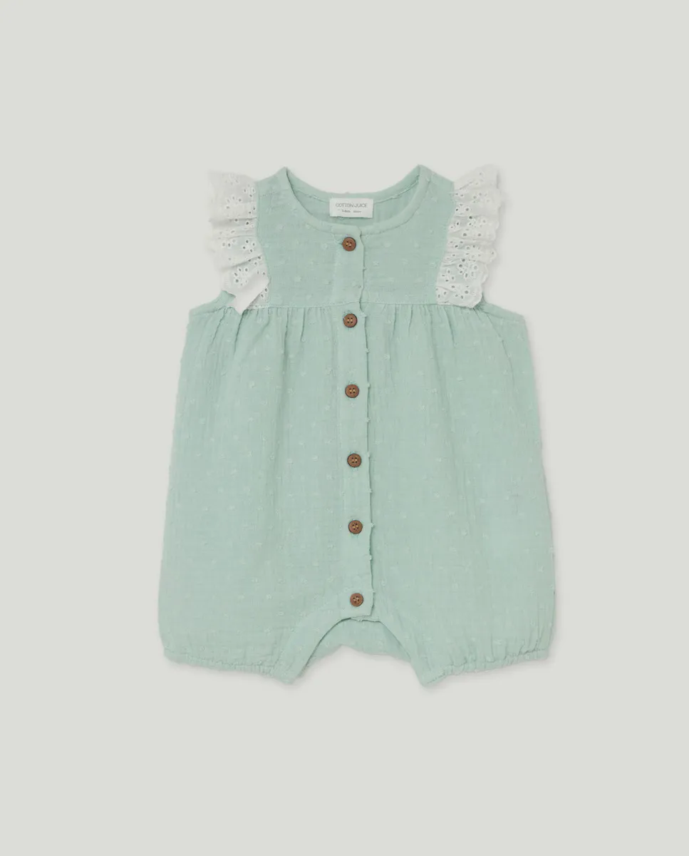 

Короткий комбинезон для девочки с плиссировкой и кружевом Cotton Juice, зеленый