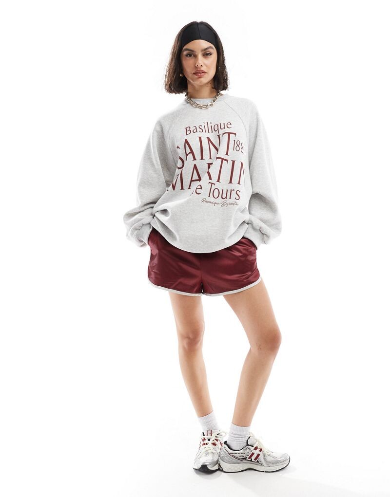 

Серый меланжевый свитшот реглан ASOS DESIGN с изображением Saint Martin