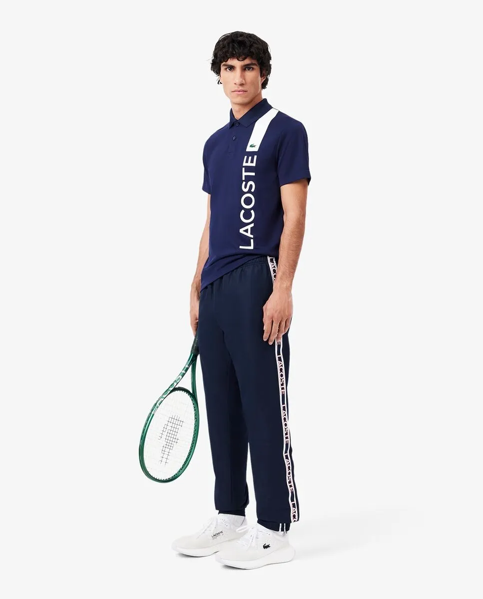 

Спортивный мужской спортивный брюки с логотипом Lacoste, темно-синий