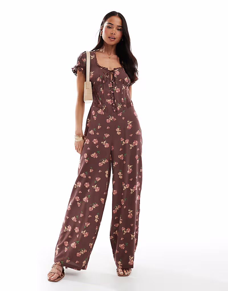 

Комбинезон ASOS DESIGN с отделкой из крученого кружева и корсетом на талии с лиловым цветочным принтом
