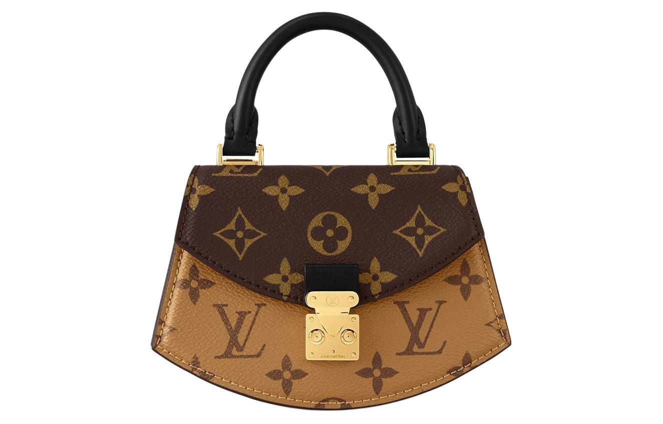 

LOUIS VUITTON Сумка-веер из прорезиненной ткани с кожаными вставками
