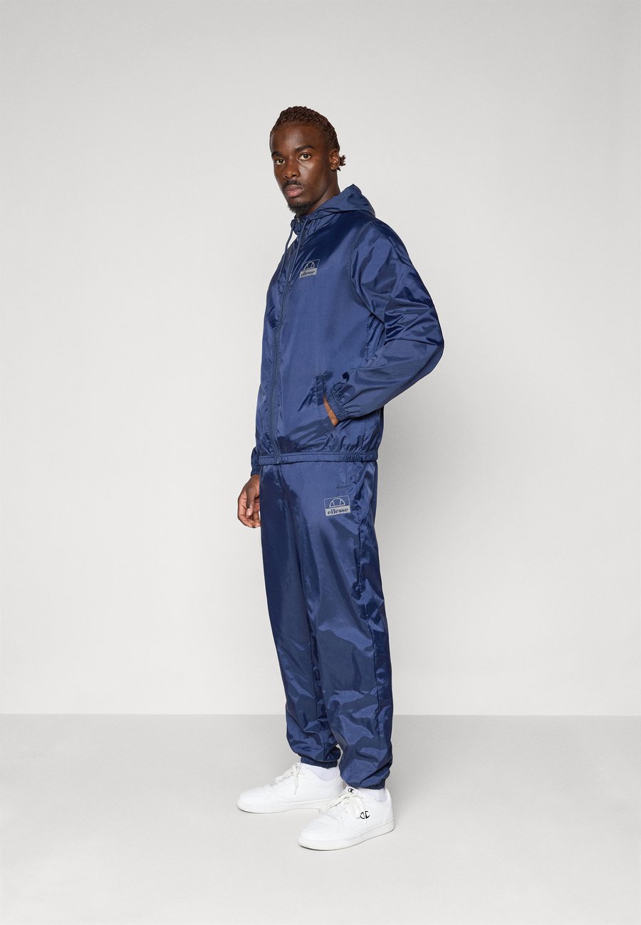 

Спортивный костюм Ellesse ROZINA JACKET AND PANT SET, Navy/Dark Blue
