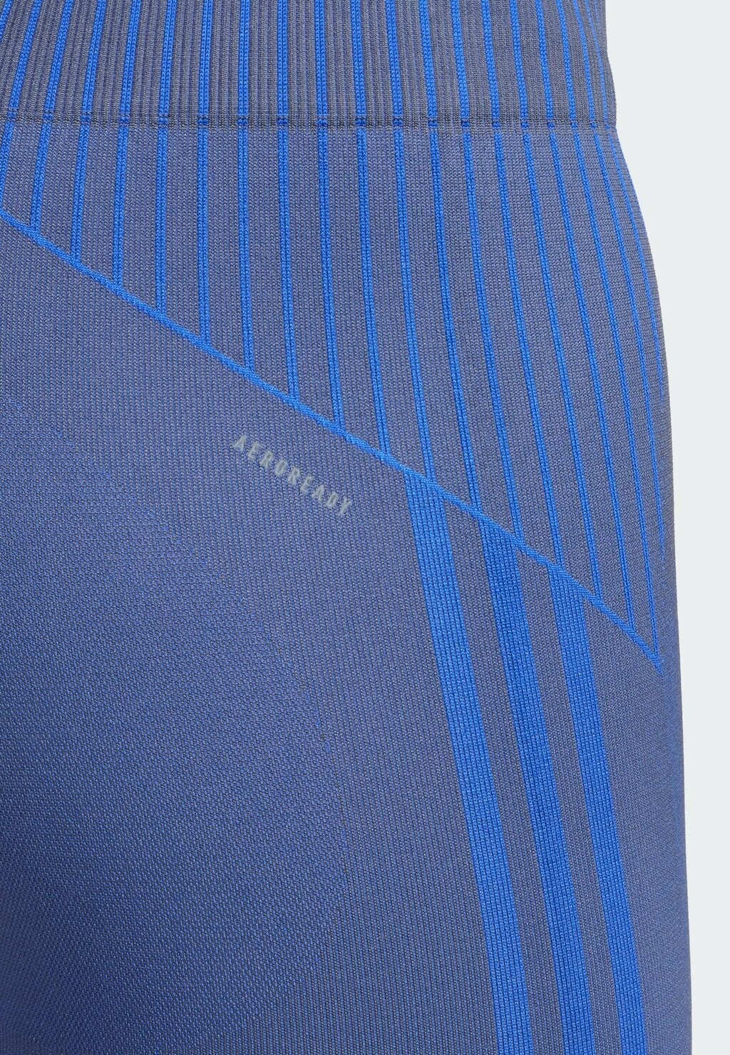 

Тайтсы SEAMLESS BRANDED 7/8 adidas, темно-синий