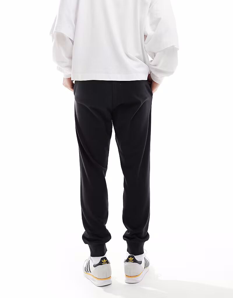Уютные брюки из французского трикотажа Adidas Essentials черного и белого цвета Adidas Performance — фото 2