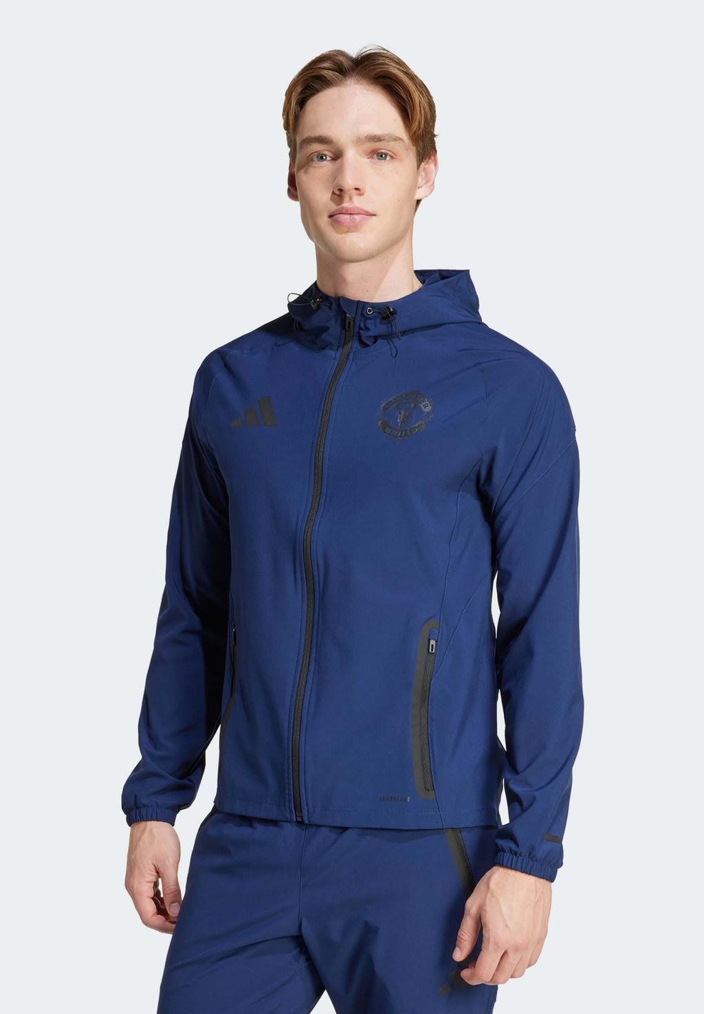 

Тренировочная куртка MANCHESTER UNITED TIRO COMPETITION VIS TECH TRAVEL - Club wear Adidas Performance, темно-синий