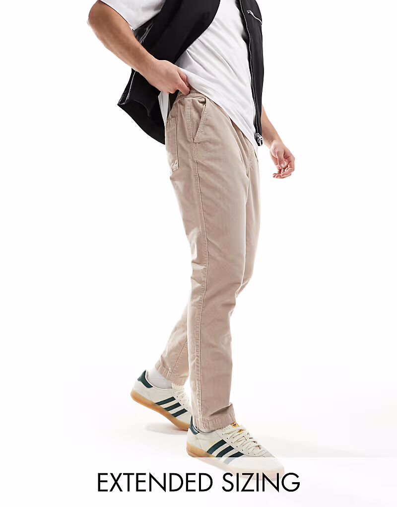 

Зауженные вельветовые брюки с эластичной талией в серо-коричневом цвете Asos Design