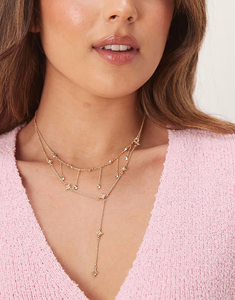 

Многорядное ожерелье в стиле лариата с небесными деталями в золотистом тоне Asos Design