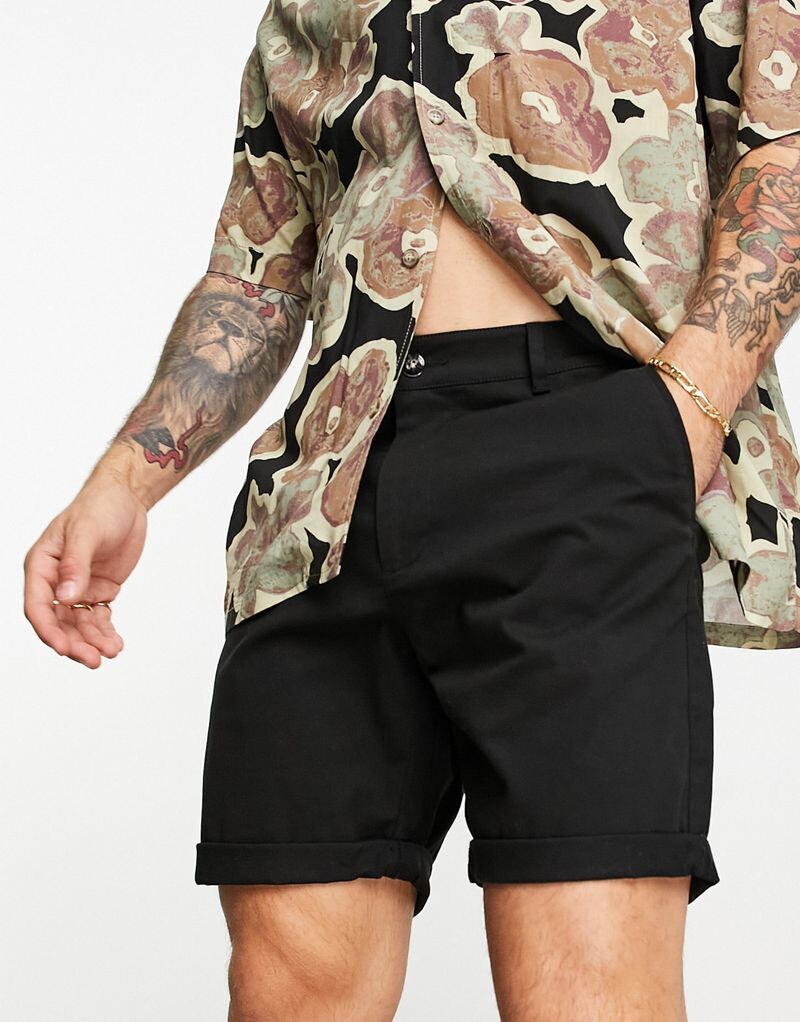 

Черные узкие шорты чинос средней длины ASOS DESIGN