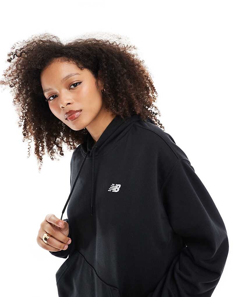 

Черная худи из френч терри New Balance Sport Essentials