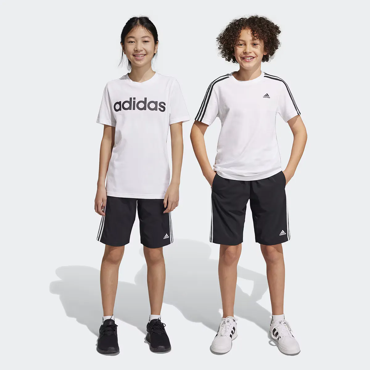 

Детские Essentials Тканые шорты в 3 полоски Adidas, чёрный