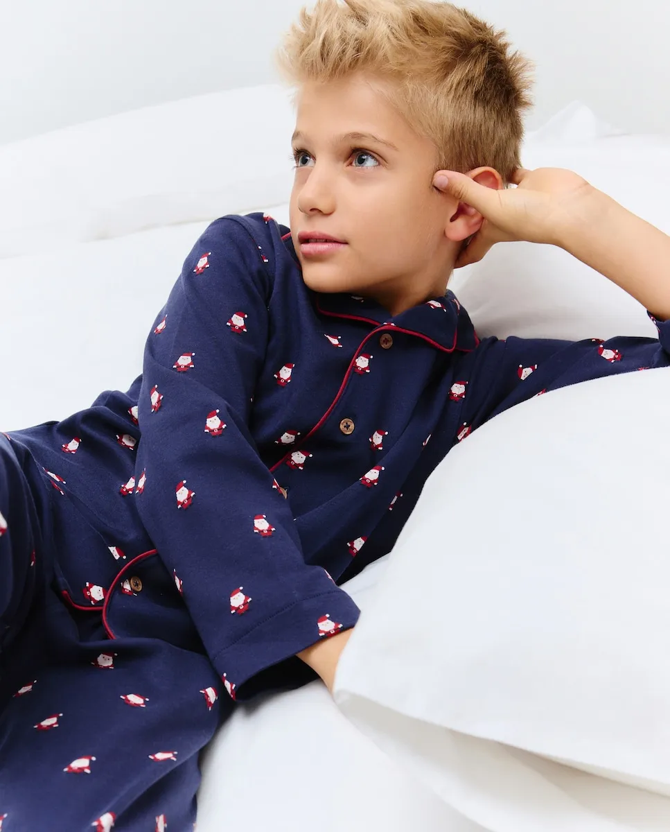 

Длинная пижама на пуговицах с рисунком Санта-Клауса для мальчика Cotton Juice, синий