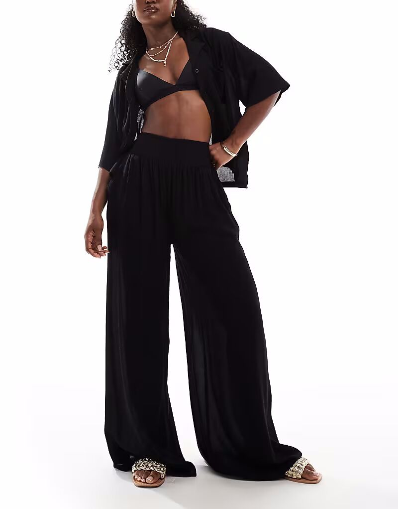 

Пляжные брюки Mix & Match из жатой ткани черного цвета Asos Design