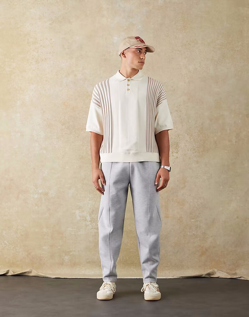 

Двусторонние зауженные книзу брюки-джоггеры с защипами серого меланжевого цвета Asos Design