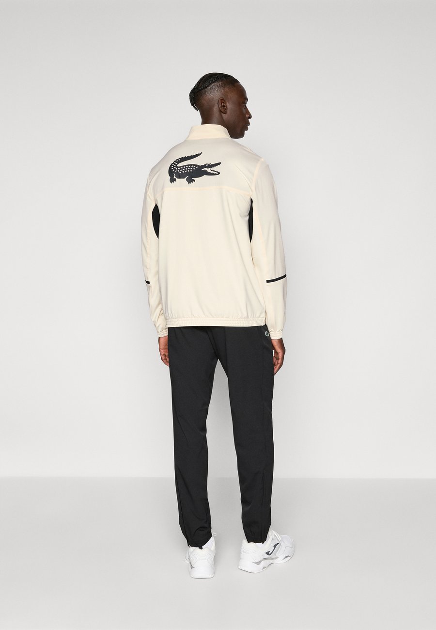 

Спортивный костюм Lacoste Sport TENNIS TRACKSUIT SET, Lapland/Black/Off-White
