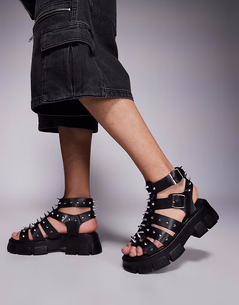 

Сандалии-гладиаторы ASOS DESIGN с заклепками на массивной подошве черного цвета