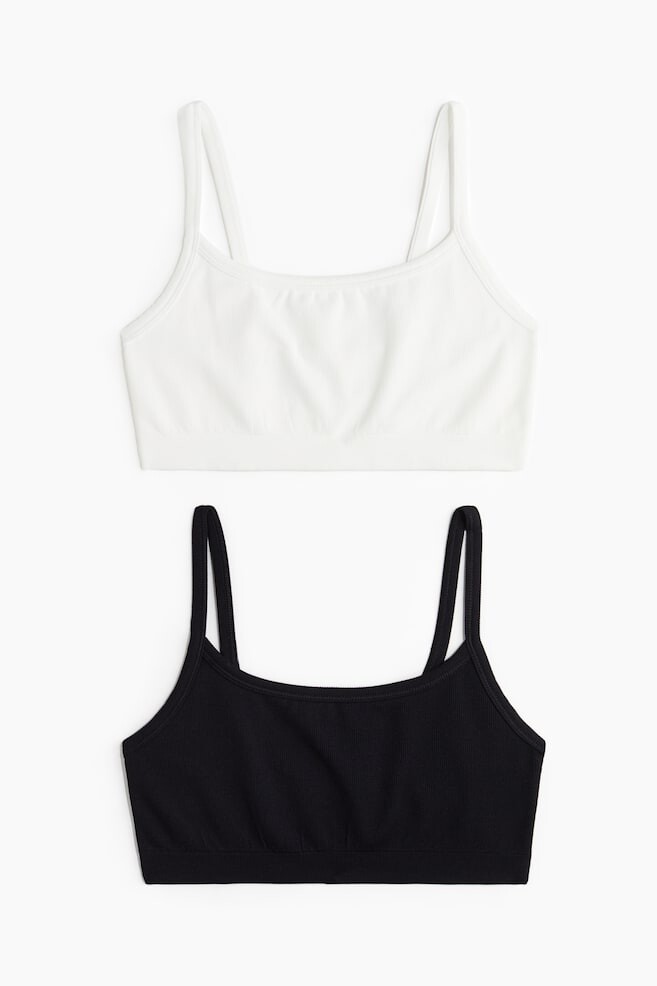 

В упаковке 2 спортивных бюстгальтера с легкой поддержкой из материала drymove H&M, черный