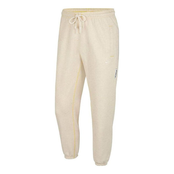 

Брюки men's dri-fit standard issue solid color casual sports long pants creamy white Nike, мультиколор
