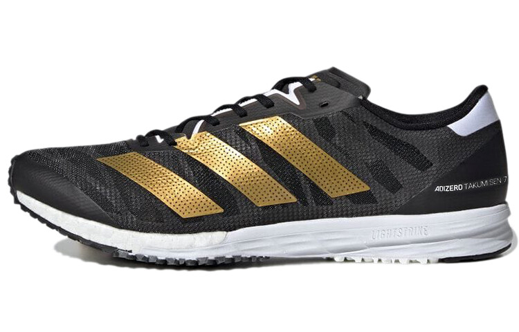 

Кроссовки Adizero Takumi Sen 7 мужские низкие черные/золотые Adidas