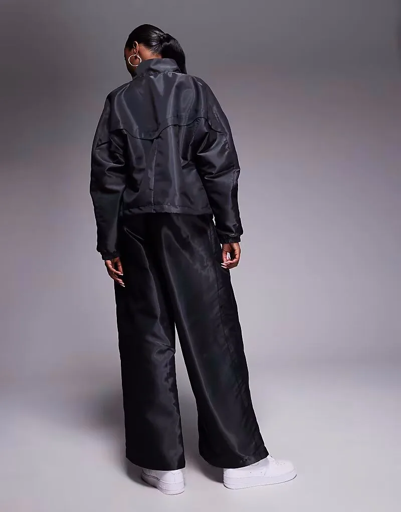 Спортивные брюки Nike Windrunner Liquid Shine черного цвета — фото 3