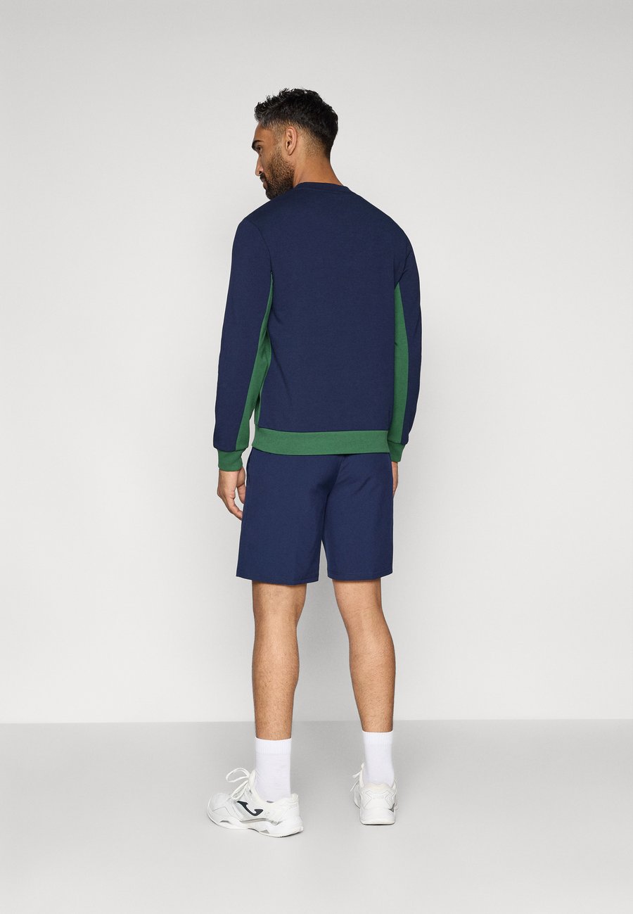 Спортивные шорты Lacoste Sport TENNIS SHORT TOUR, Navy Blue/Dark Blue — фото 3