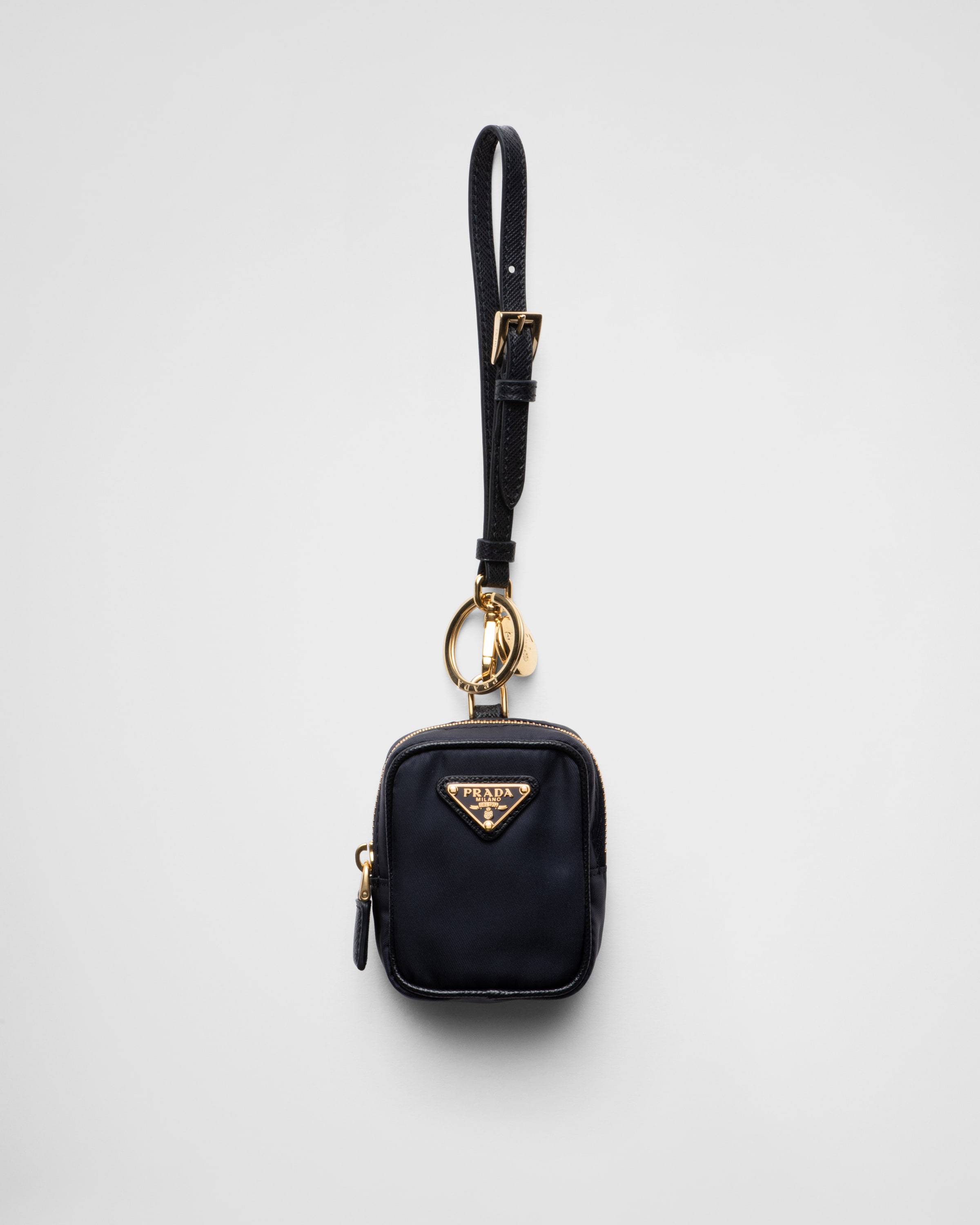 

Мини-сумка Prada Re-Edition 1978 из переработанного нейлона Prada, синий