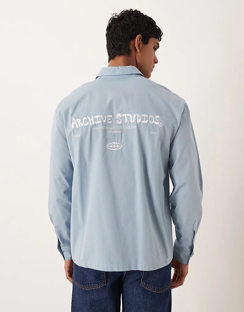 

Свободная рубашка ASOS DESIGN синего цвета с вышивкой на груди и спине