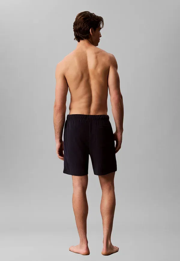 Плавки Calvin Klein Swimwear с длинным шнурком, цвет береговой линии — фото 3