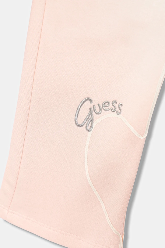 Детские хлопковые спортивные штаны Guess, розовый — фото 3