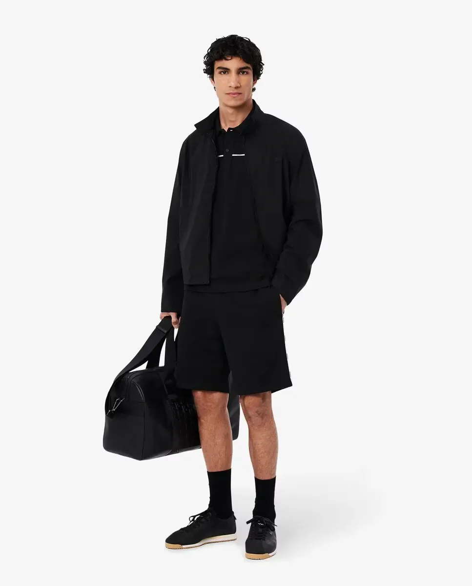 Мужское поло стандартного кроя с логотипом на манжете коротких рукавов Lacoste, черный — фото 4