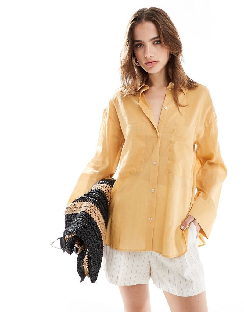 

Оранжевая рубашка оверсайз Mango