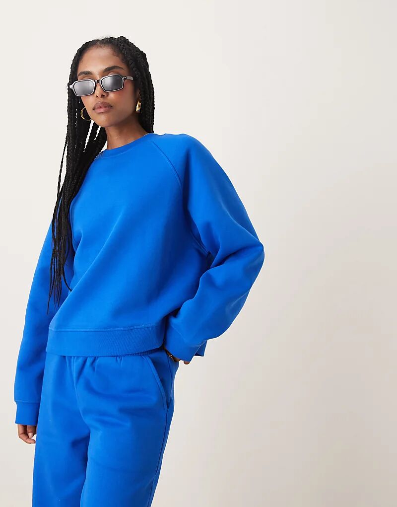 

Толстовка ASOS DESIGN свободного кроя с начесом сзади и регланами синего цвета