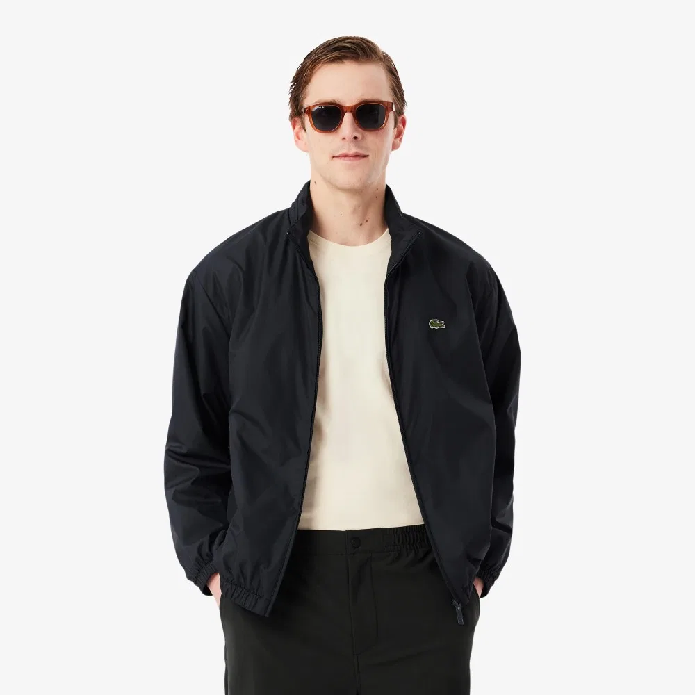 Мужская тёмно-синяя ветровка с высоким воротником от Lacoste