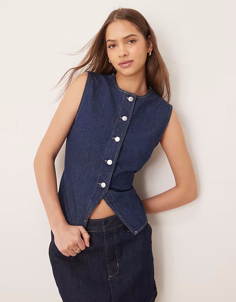 

Джинсовый жилет ASOS DESIGN цвета индиго с завязкой на поясе
