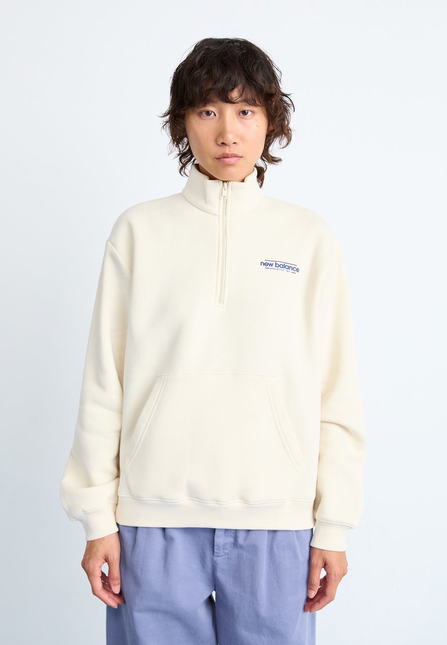 

Толстовка New Balance REIMAGINED HALF ZIP, Beige