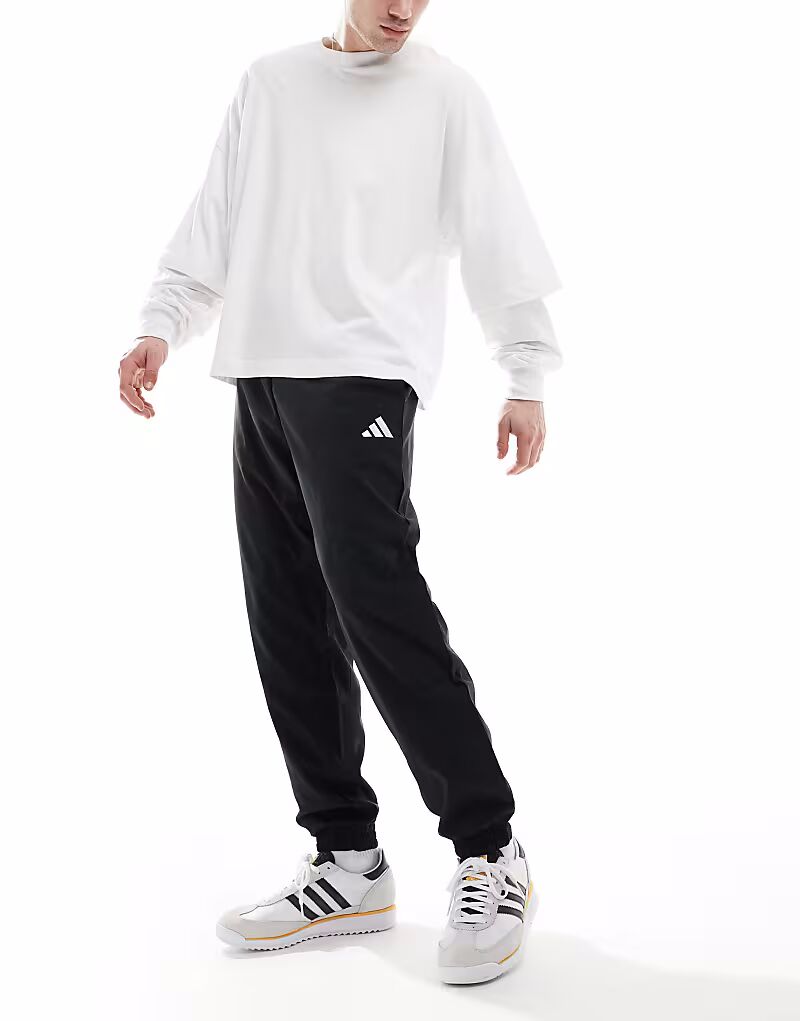 

Штаны Adidas Essentials small logo stanford черного / белого цвета Adidas Performance
