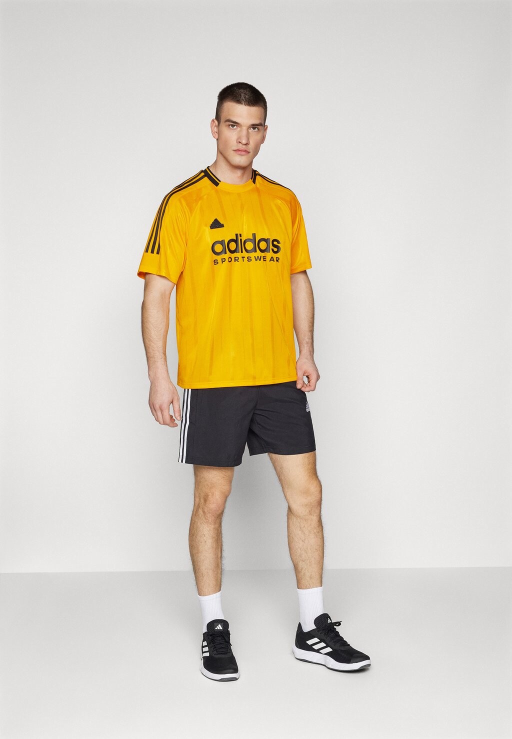 

Футболка с принтом House Of Tiro Nations Pack Tee adidas Sportswear, оранжевый/черный