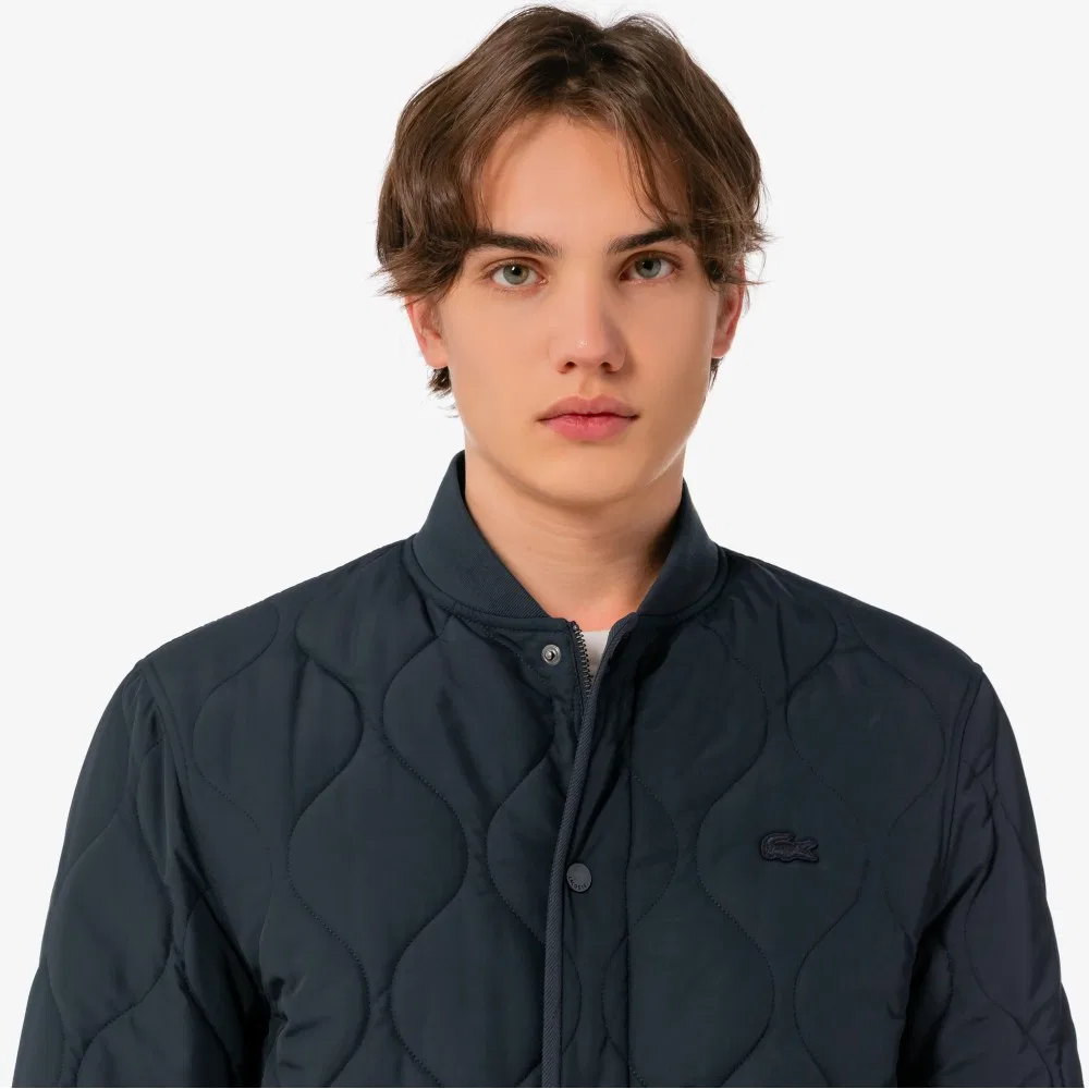Мужская стёганая куртка-бомбер с луковичным узором серая от Lacoste — фото 2