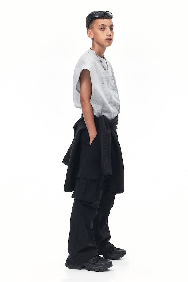 

Водоотталкивающие спортивные брюки H&M, черный