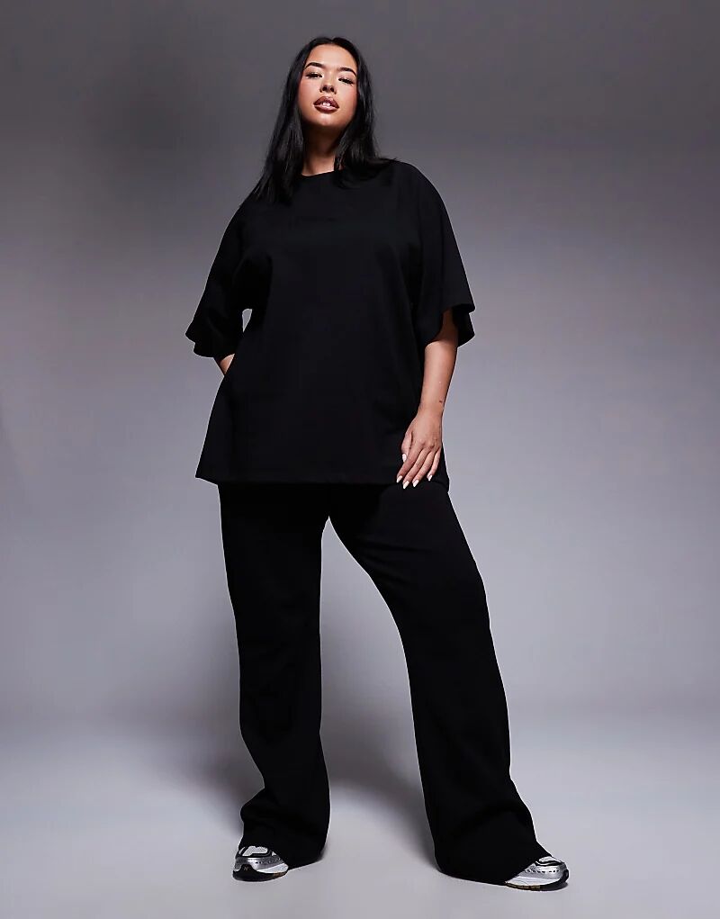 

Расклешенные спортивные брюки Curve из джерси ASOS DESIGN черного цвета — часть комплекта Asos Curve