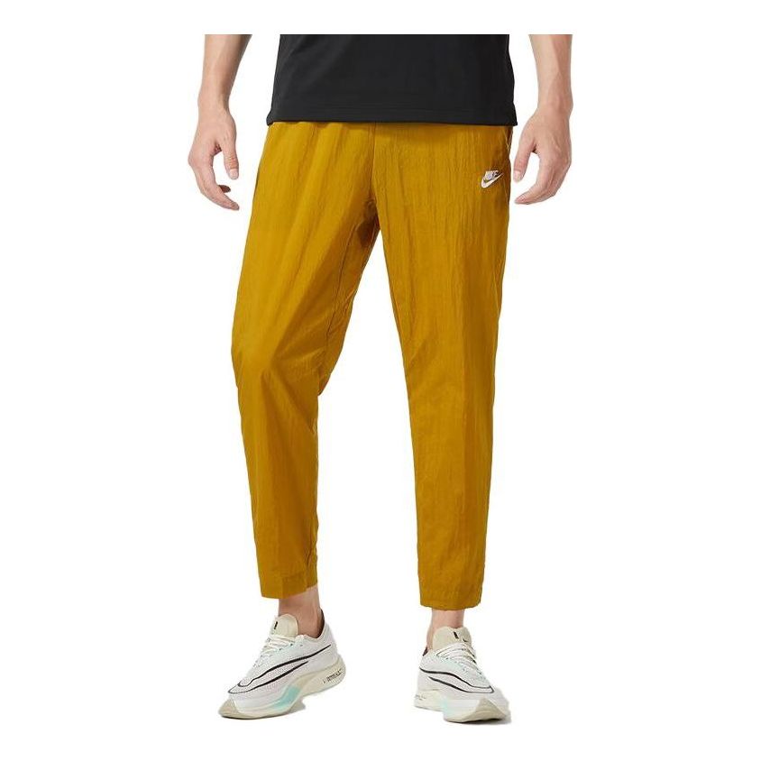 

Спортивные брюки Nike Club Lightweight Woven Trousers 'Bronzine', желтый